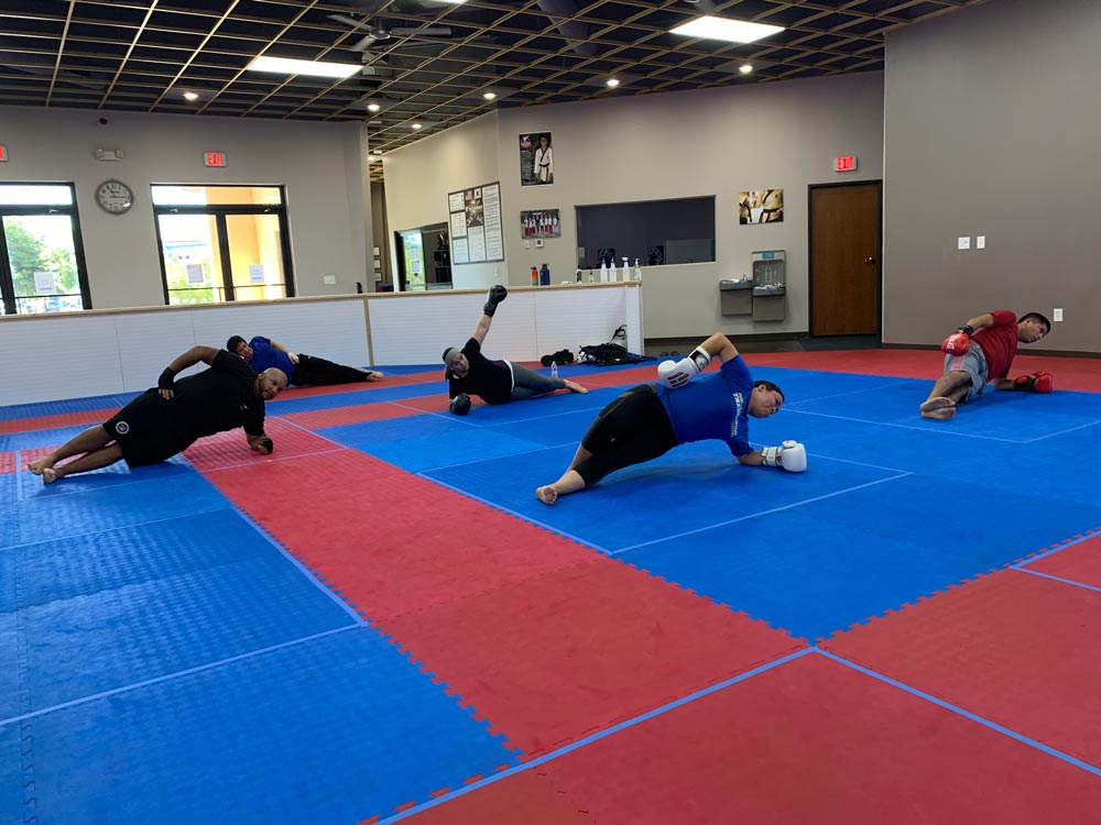 kickboxing-students-planking